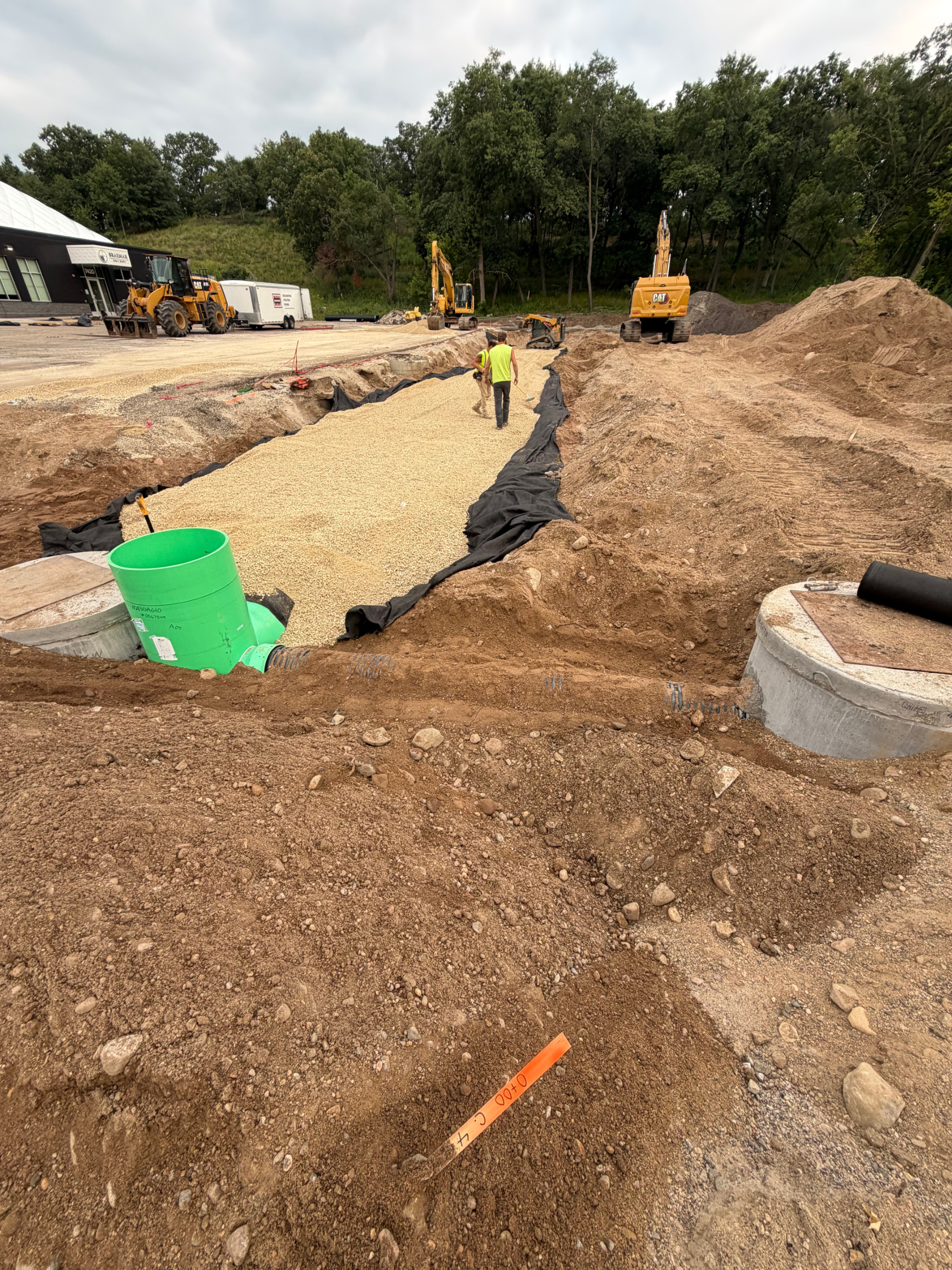 Storm infiltration system that will treat new parking surface