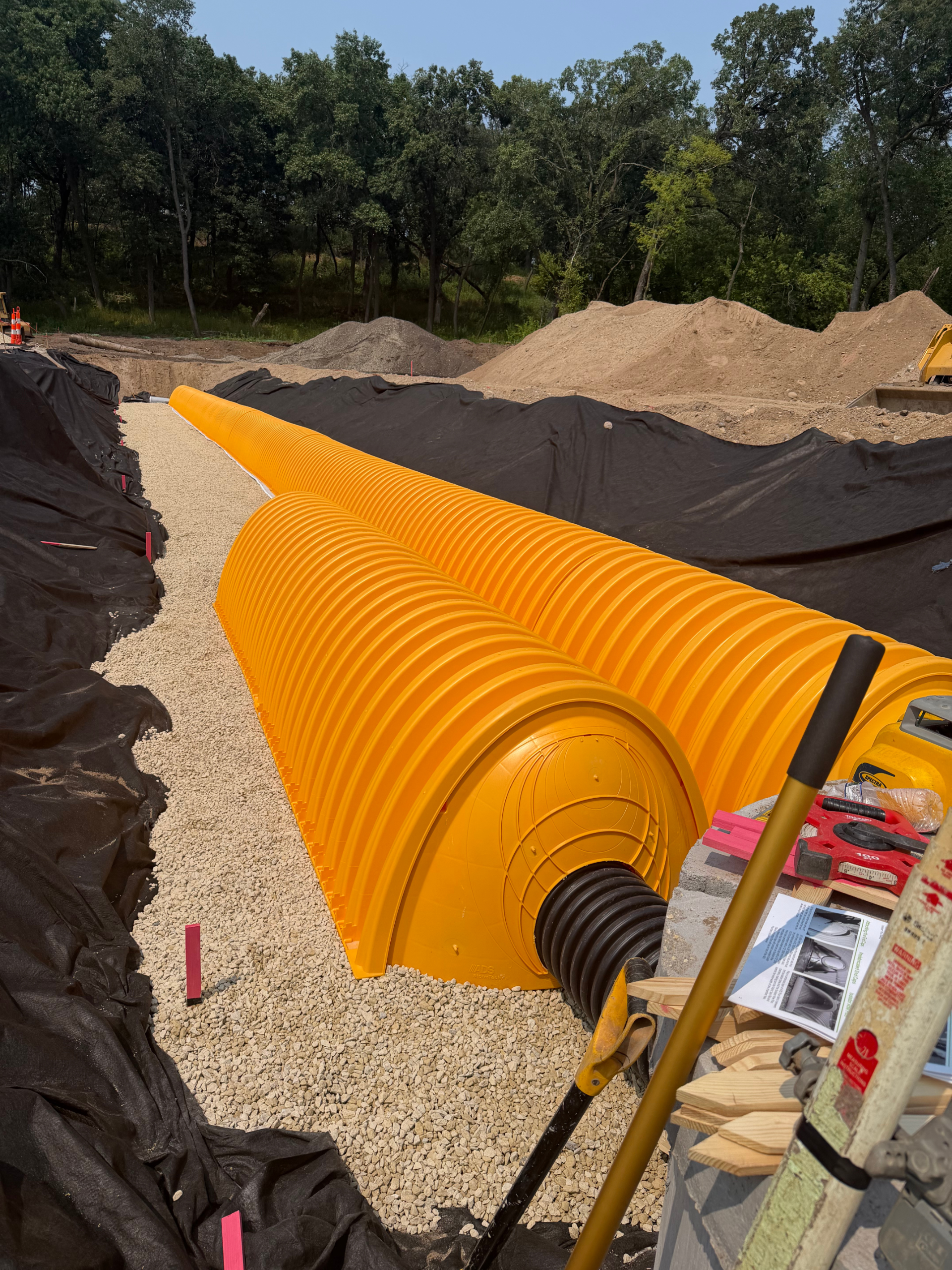 Storm system resides under parking surface
